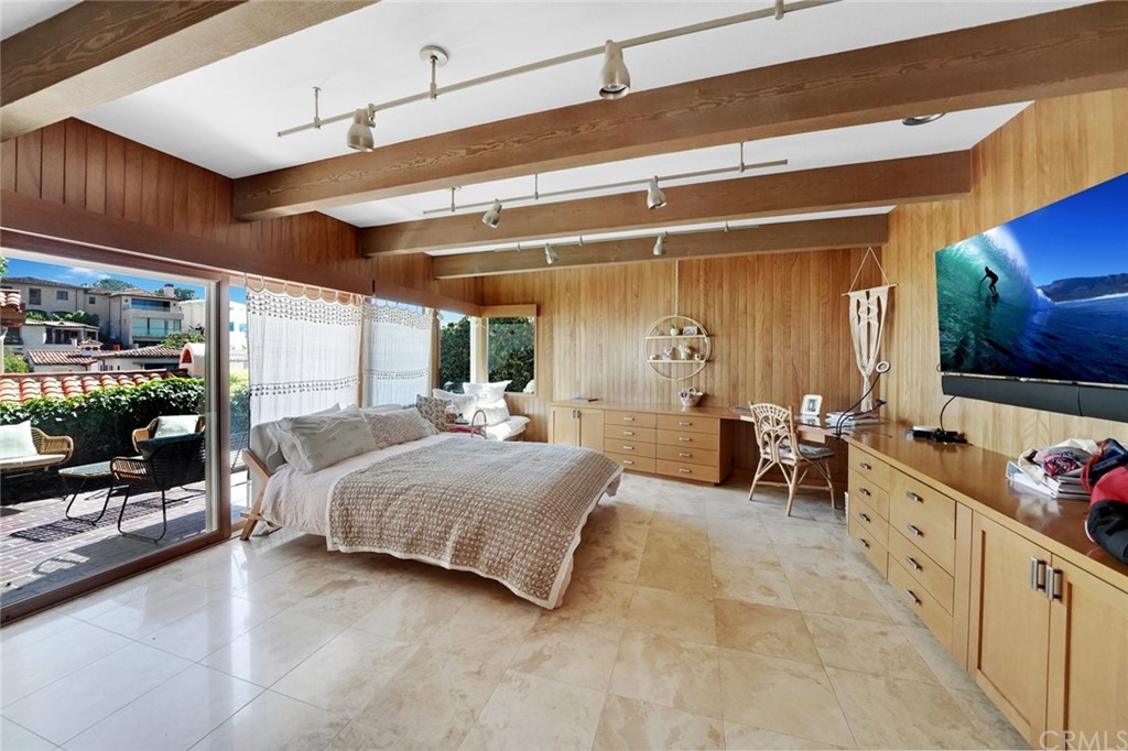 37 Emerald Bay Laguna Beach, CA 92651 - Photo 39 of 52 a bedroom with furniture and a flat screen tv