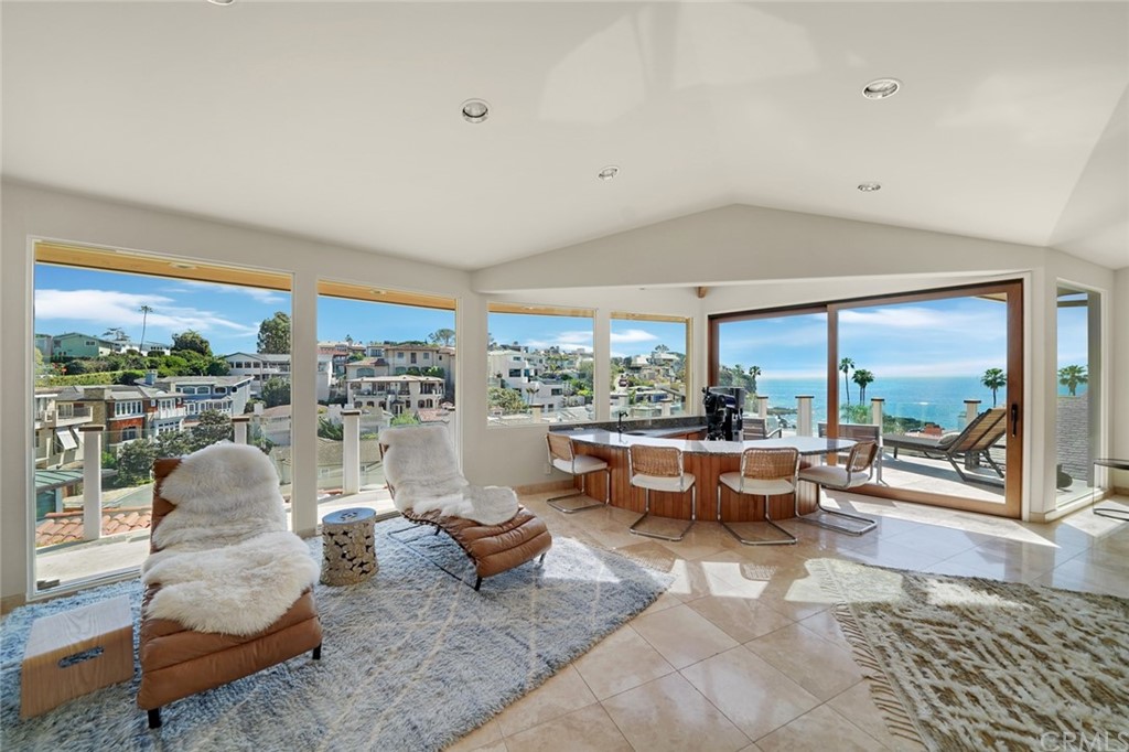 37 Emerald Bay Laguna Beach, CA 92651 - Photo 4 of 52 a living room with furniture and a floor to ceiling window
