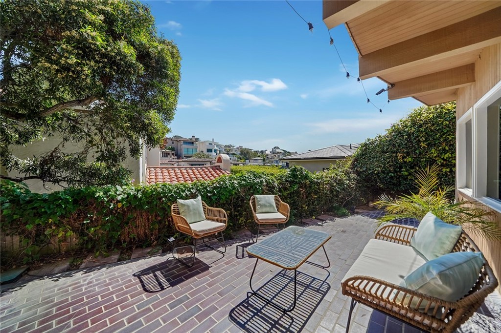 37 Emerald Bay Laguna Beach, CA 92651 - Photo 41 of 52 a view of a patio with couches table and chairs and potted plants