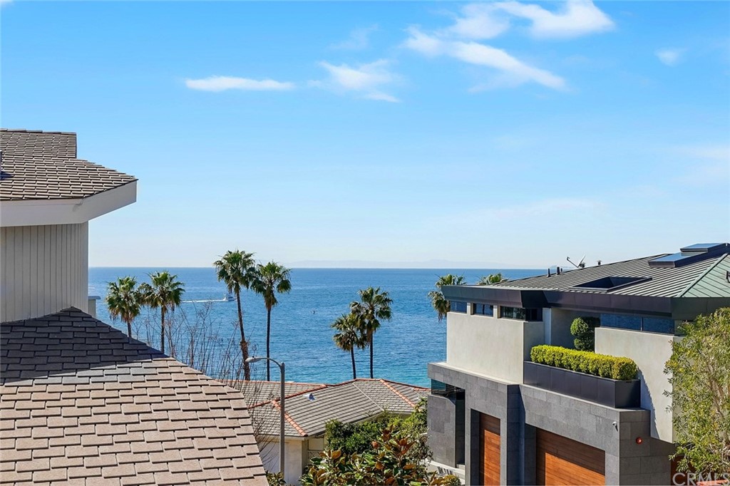 37 Emerald Bay Laguna Beach, CA 92651 - Photo 9 of 52 a terrace with a table and chairs with potted plants