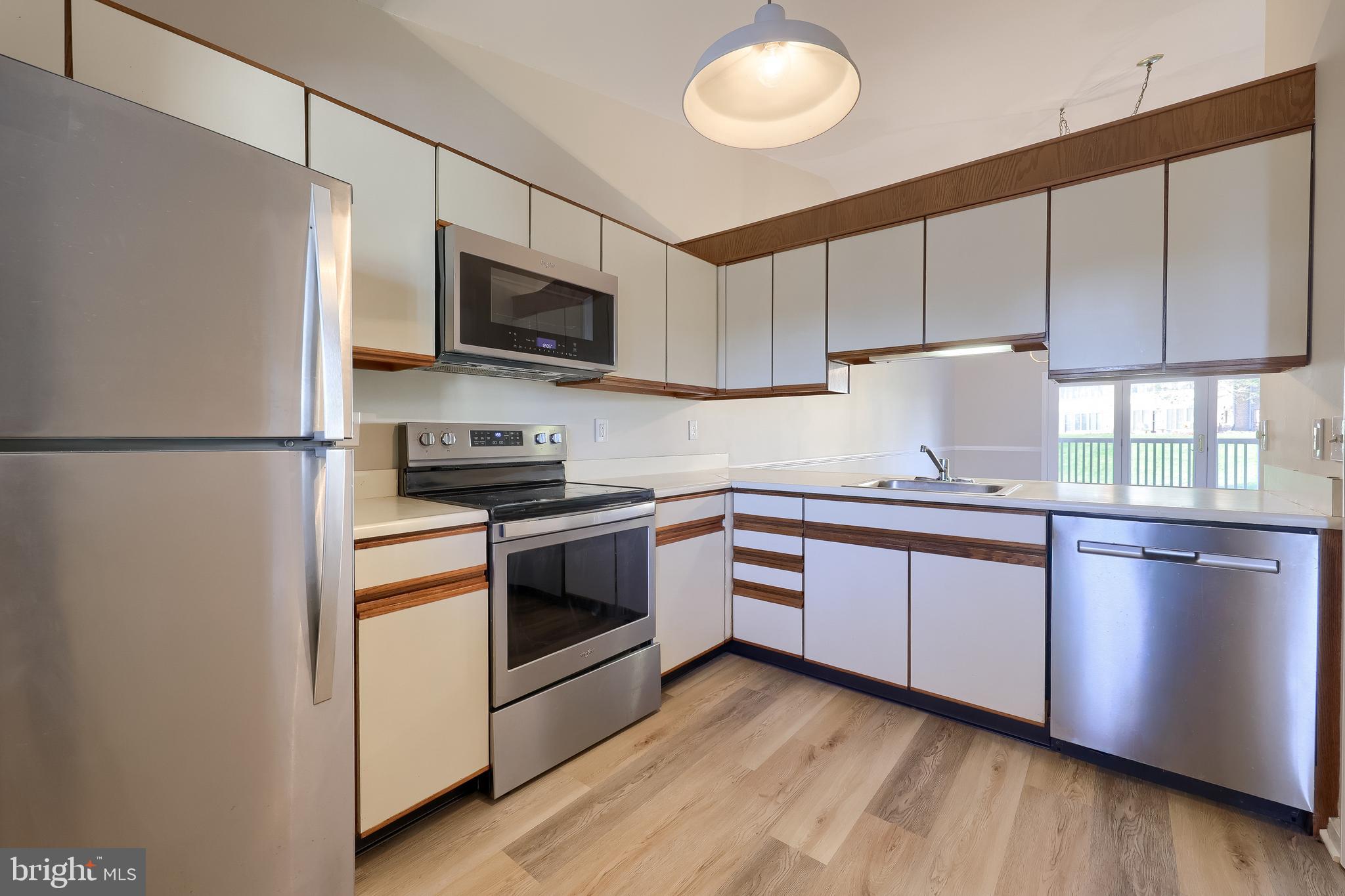 33 Black Oak Drive Lancaster, PA 17602 - Photo 12 of 46 a kitchen with stainless steel appliances granite countertop a refrigerator a stove a sink and a microwave