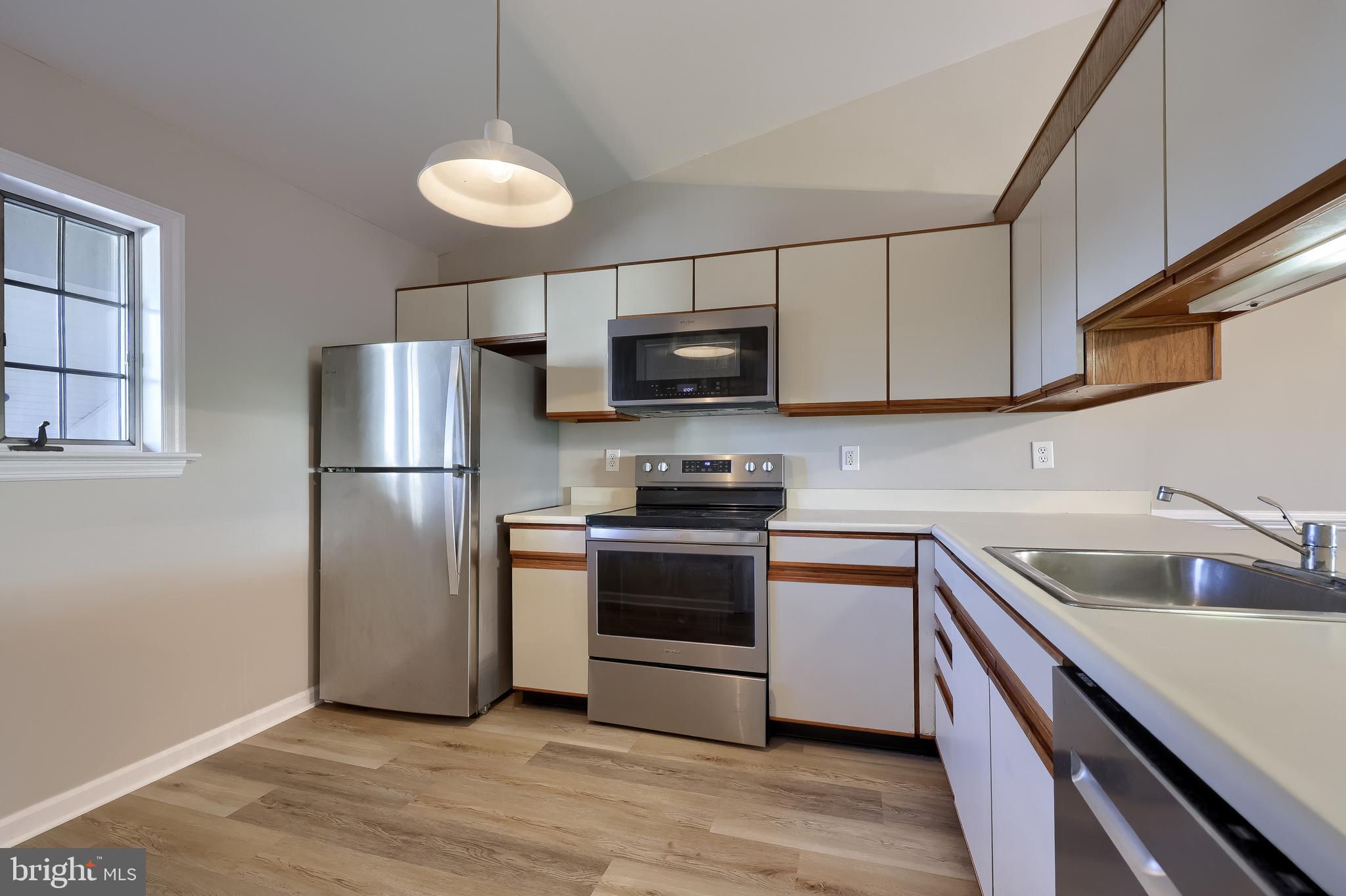 33 Black Oak Drive Lancaster, PA 17602 - Photo 13 of 46 a kitchen with stainless steel appliances granite countertop a refrigerator a stove a sink and a microwave