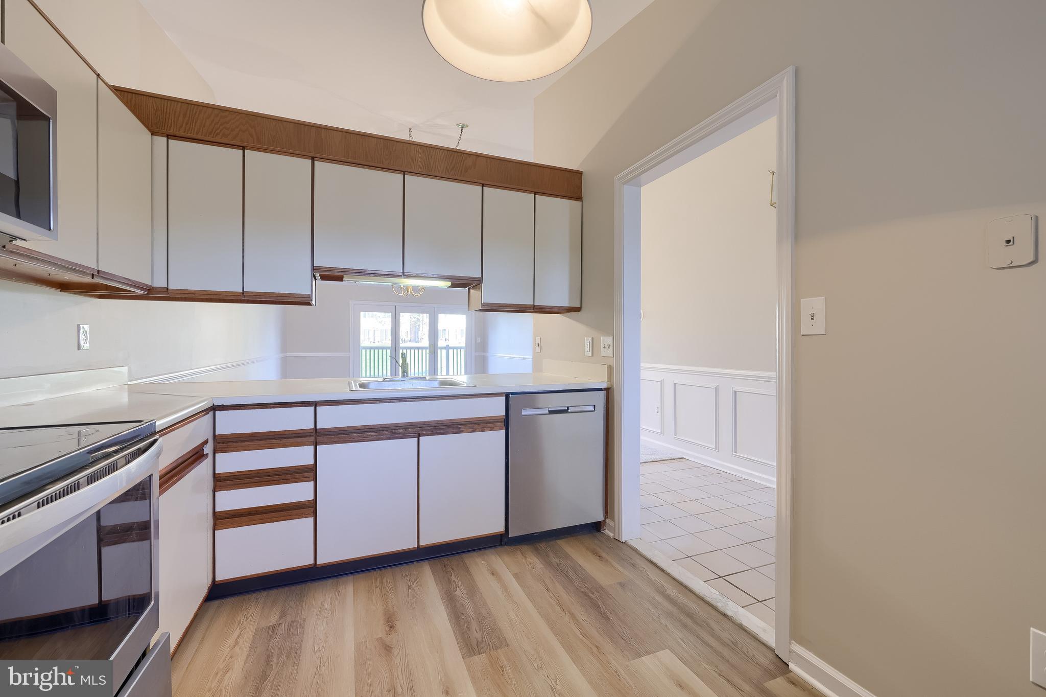 33 Black Oak Drive Lancaster, PA 17602 - Photo 15 of 46 a kitchen with granite countertop white cabinets and white appliances