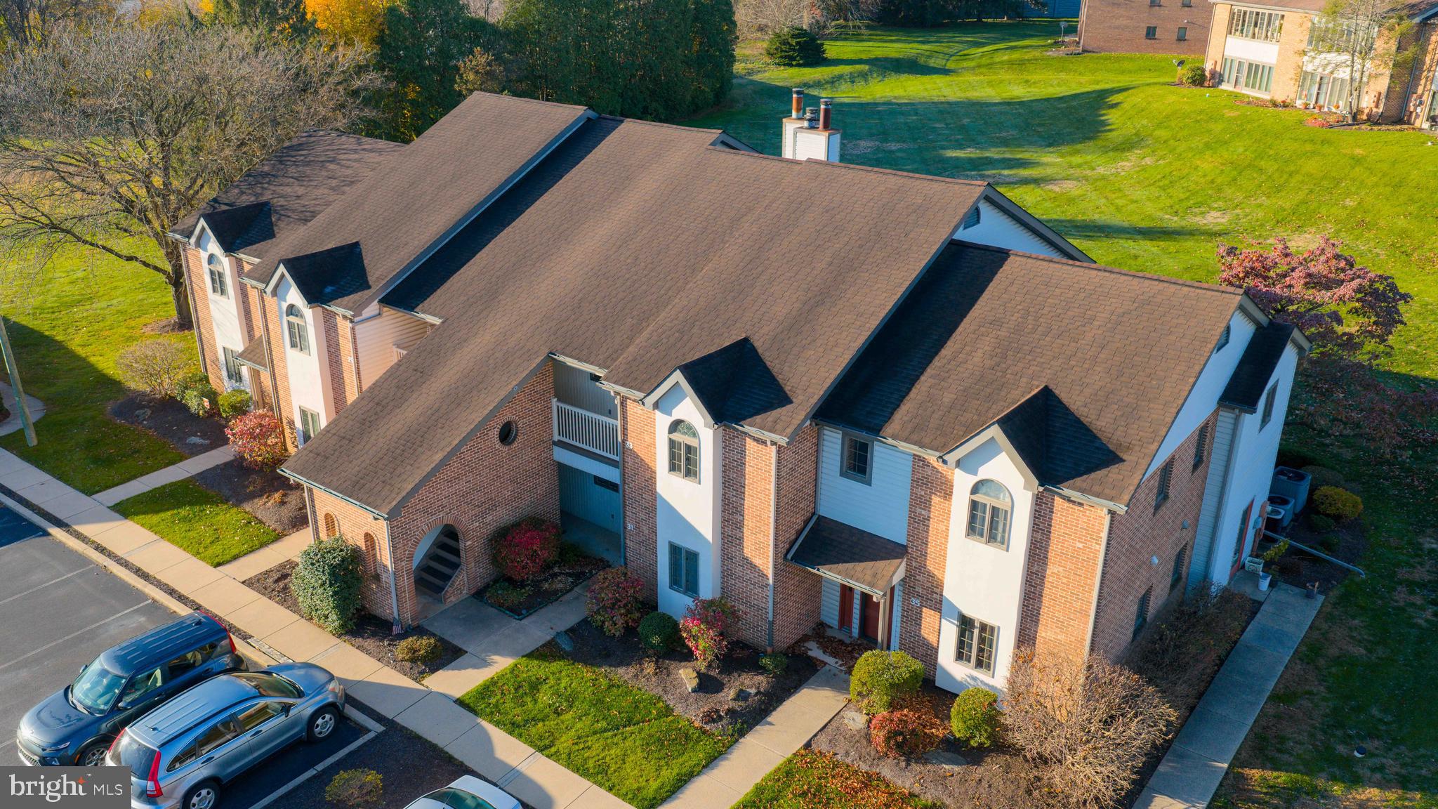 33 Black Oak Drive Lancaster, PA 17602 - Photo 39 of 46 an aerial view of a house with swimming pool and large trees