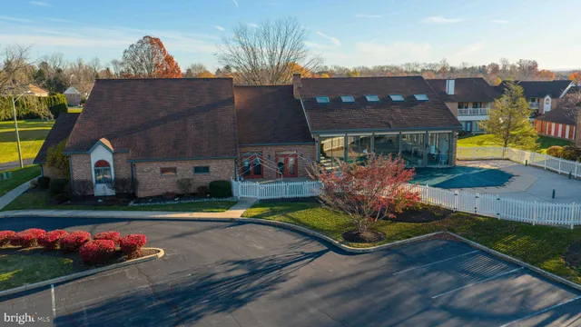 a view of a house with a yard potted plants