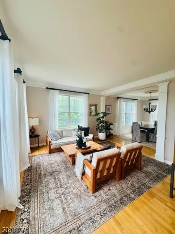 a bedroom with furniture and a rug