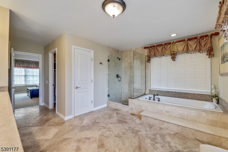 2 Bedford Drive Bernards, NJ 07920 - Photo 21 of 33 a bathroom with a tub and shower