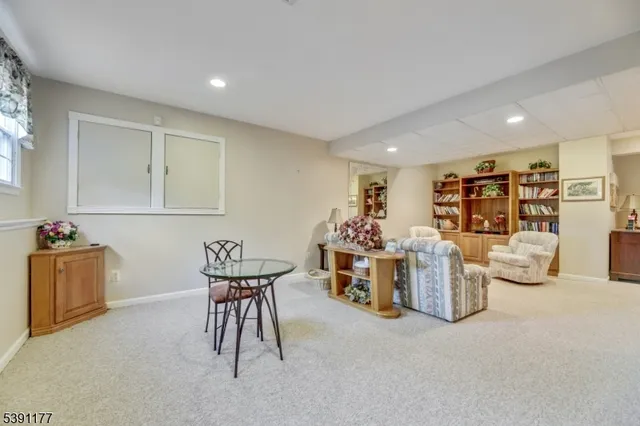 a room with furniture and air hockey table