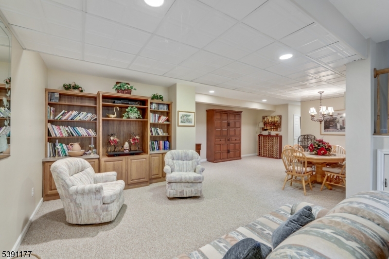 2 Bedford Drive Bernards, NJ 07920 - Photo 24 of 33 a living room with furniture and a book shelf