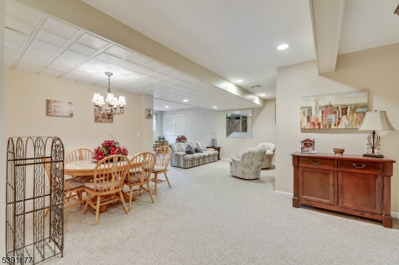 2 Bedford Drive Bernards, NJ 07920 - Photo 26 of 33 a living room with furniture and a flat screen tv