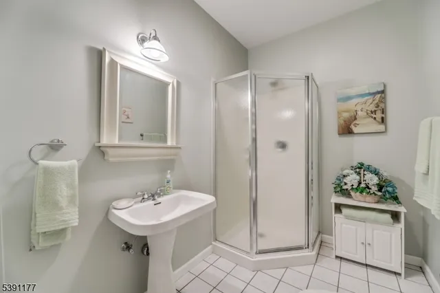 a bathroom with a sink toilet and mirror