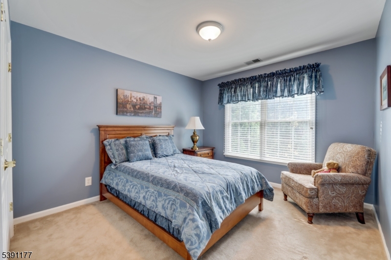 2 Bedford Drive Bernards, NJ 07920 - Photo 28 of 33 a bedroom with a bed and a couch