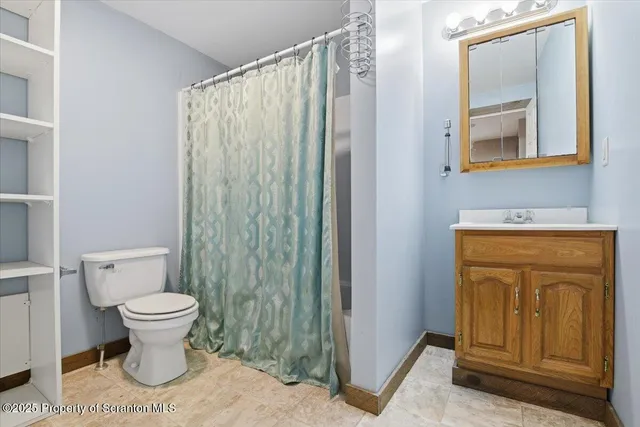 a bathroom with a toilet and a sink