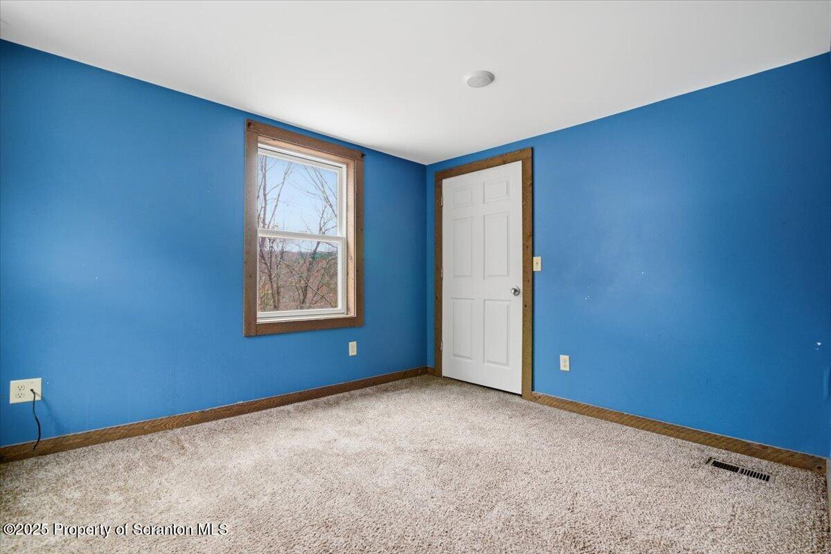 760 Hudson Street Hawley, PA 18428 - Photo 17 of 31 an empty room with windows