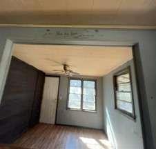 904 Travelers Home Church Road Ideal, GA 31041 - Photo 14 of 14 a view of an empty room with wooden floor and a window