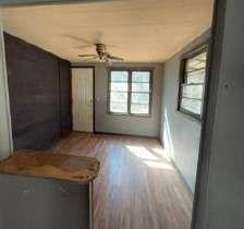 904 Travelers Home Church Road Ideal, GA 31041 - Photo 9 of 14 an empty room with wooden floor and windows