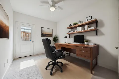 a view of a workspace with furniture