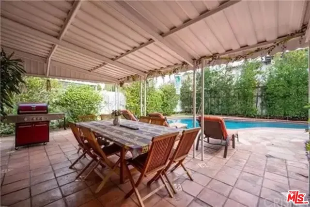 a patio with table and chairs