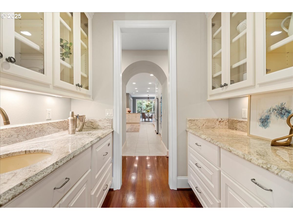 5436 Southwest Champion Place Portland, OR 97225 - Photo 12 of 37 a hallway with sink and mirror