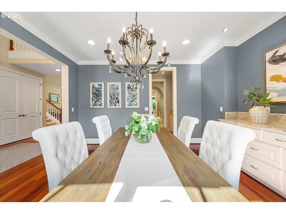 5436 Southwest Champion Place Portland, OR 97225 - Photo 13 of 37 a living room with furniture dining table and a chandelier