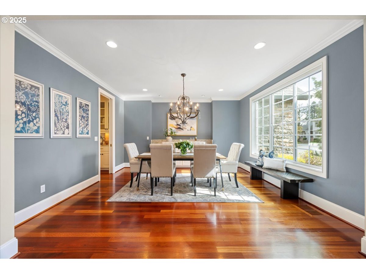 5436 Southwest Champion Place Portland, OR 97225 - Photo 14 of 37 a dining room with furniture a chandelier and wooden floor