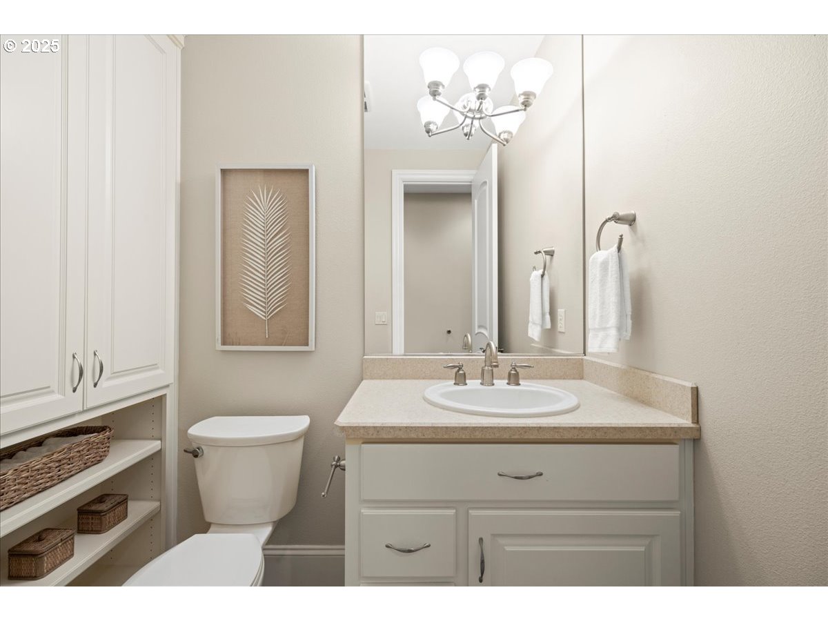 5436 Southwest Champion Place Portland, OR 97225 - Photo 18 of 37 a bathroom with a sink vanity mirror and toilet
