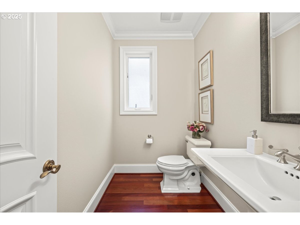 5436 Southwest Champion Place Portland, OR 97225 - Photo 20 of 37 a bathroom with a toilet a sink and a mirror