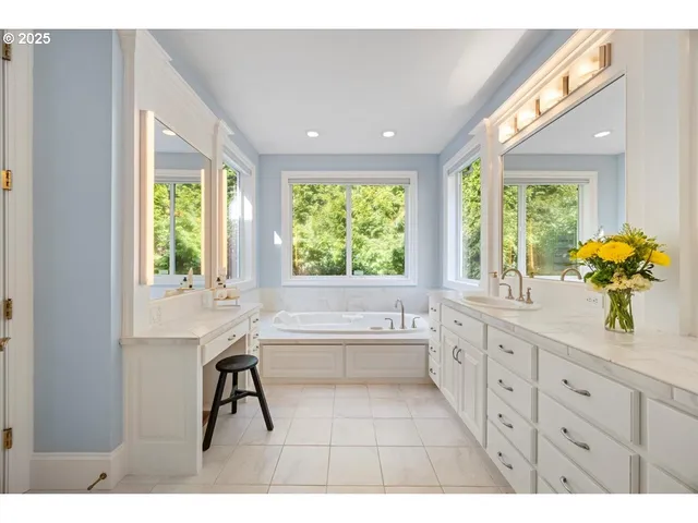 a bathroom with a sink a vanity and a mirror