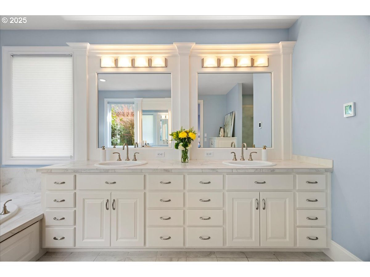 5436 Southwest Champion Place Portland, OR 97225 - Photo 24 of 37 a bathroom with a sink a vanity and a mirror