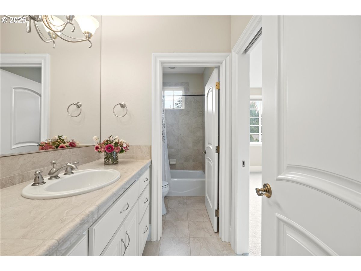 5436 Southwest Champion Place Portland, OR 97225 - Photo 29 of 37 a bathroom with a sink vanity tub and a mirror
