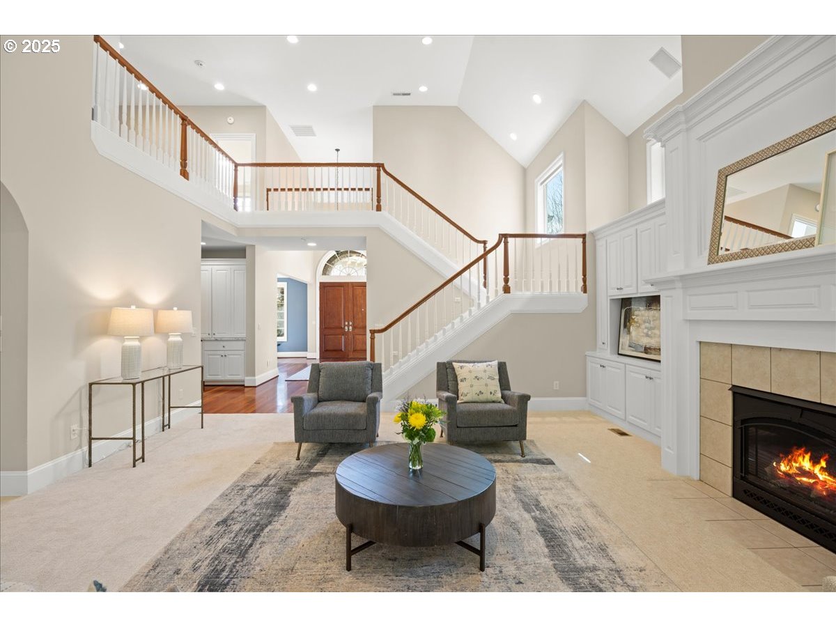 5436 Southwest Champion Place Portland, OR 97225 - Photo 3 of 37 a living room with furniture and a fireplace