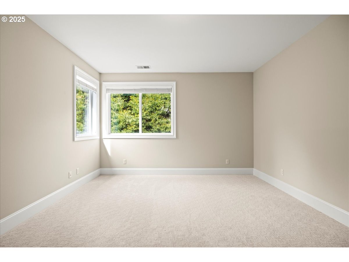 5436 Southwest Champion Place Portland, OR 97225 - Photo 35 of 37 an empty room with windows