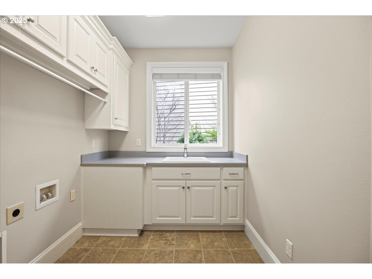 5436 Southwest Champion Place Portland, OR 97225 - Photo 36 of 37 a kitchen with a sink cabinets and window