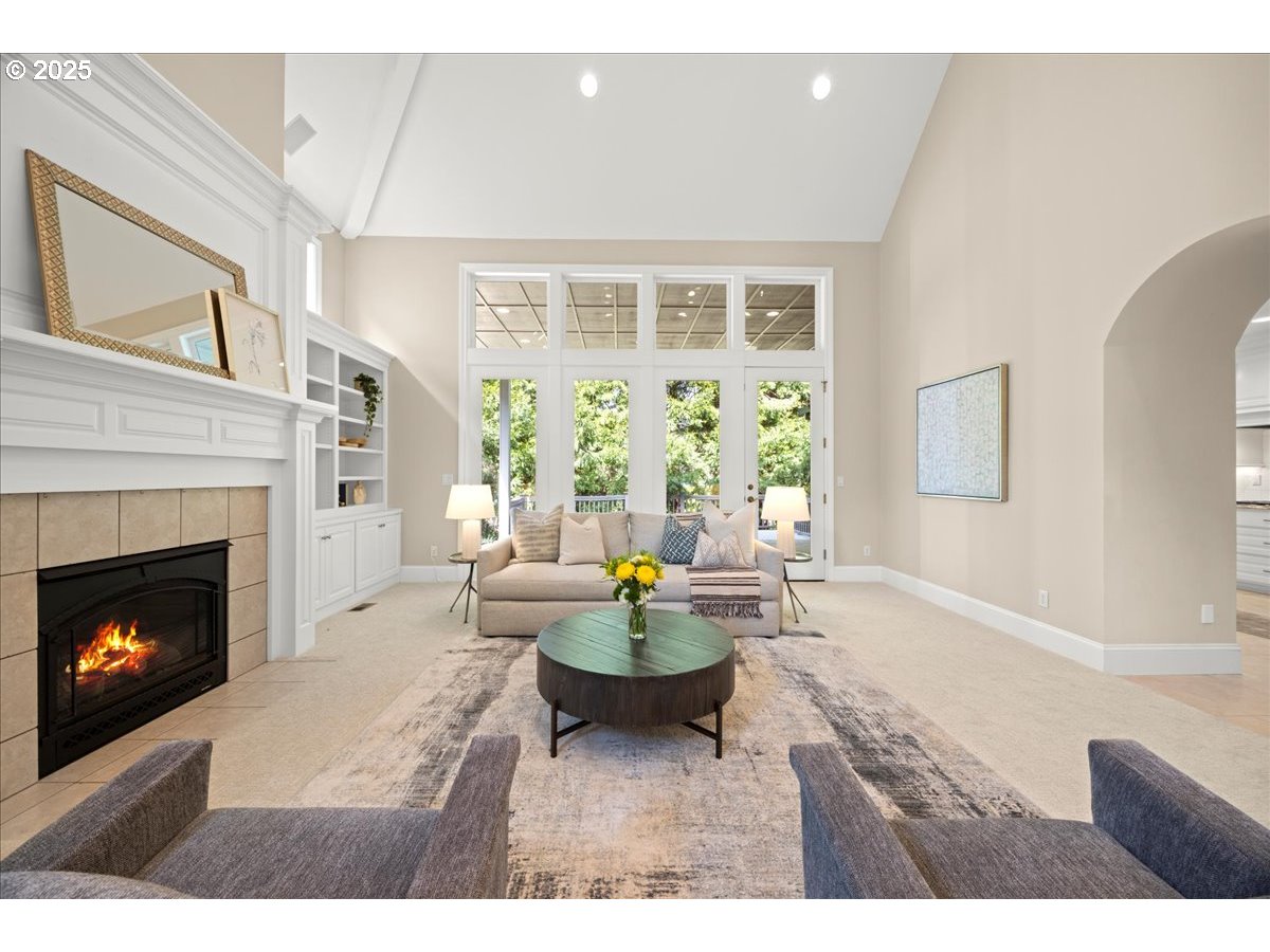 5436 Southwest Champion Place Portland, OR 97225 - Photo 4 of 37 a living room with furniture a fireplace and a large window