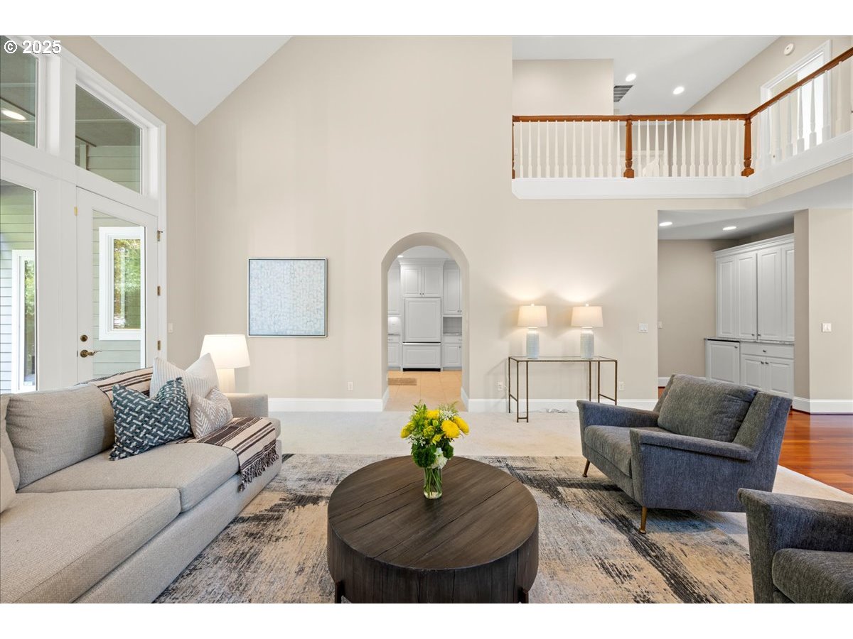 5436 Southwest Champion Place Portland, OR 97225 - Photo 5 of 37 a living room with furniture and a chandelier