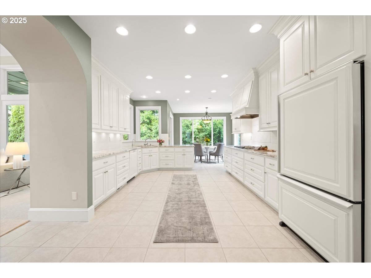 5436 Southwest Champion Place Portland, OR 97225 - Photo 9 of 37 a view of a kitchen with a refrigerator and a window