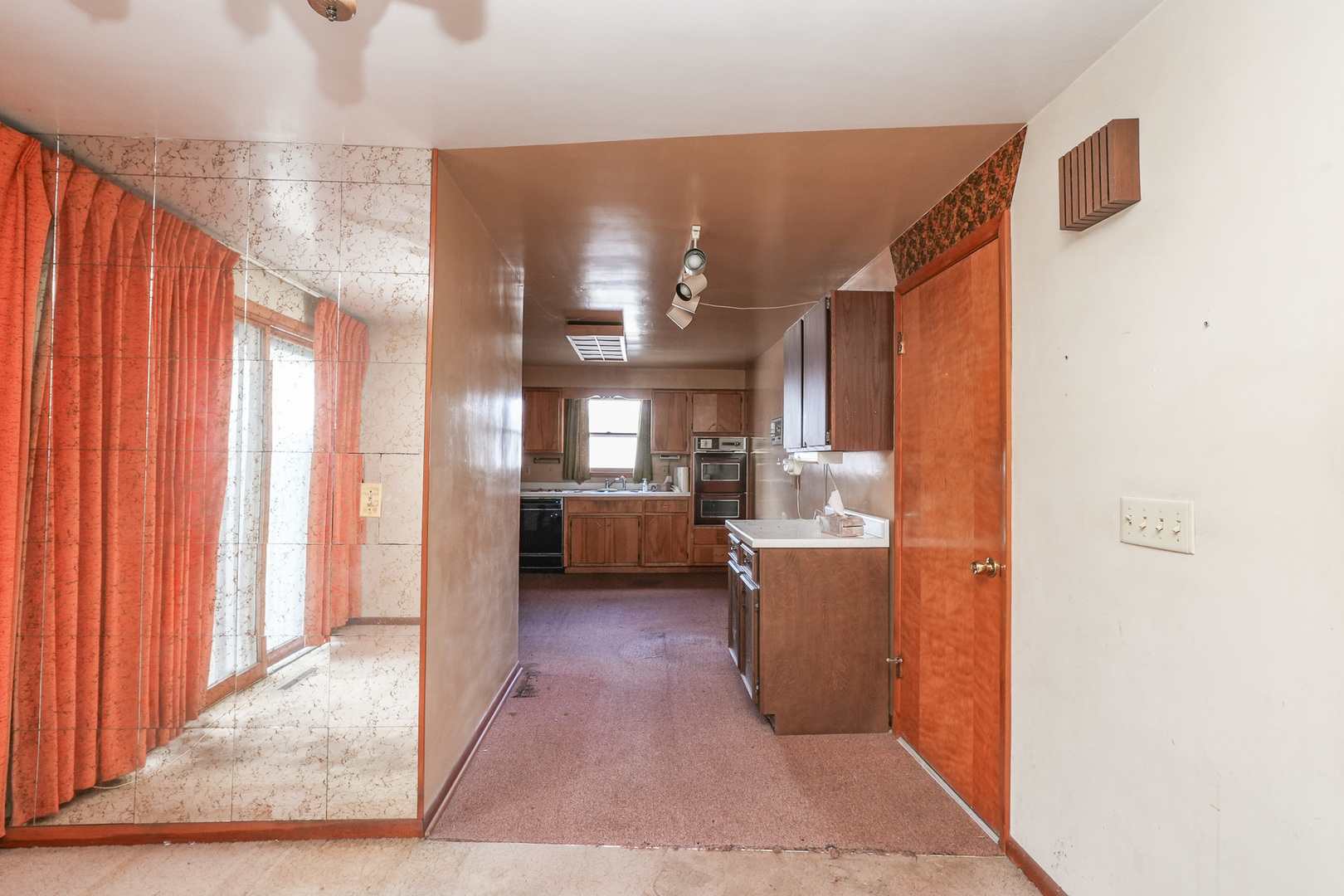 164 North 5620W Road Kankakee, IL 60901 - Photo 15 of 37 a view of a living room and kitchen with furniture and a window