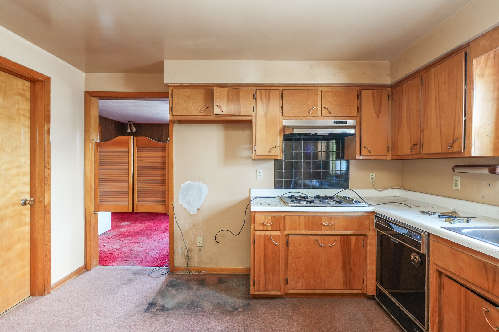 164 North 5620W Road Kankakee, IL 60901 - Photo 20 of 37 a kitchen with a stove and a cabinets