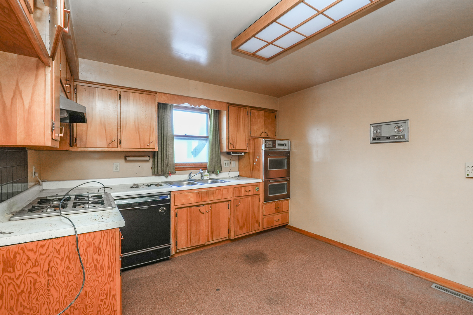 164 North 5620W Road Kankakee, IL 60901 - Photo 22 of 37 a kitchen with stainless steel appliances granite countertop a stove a sink and a refrigerator