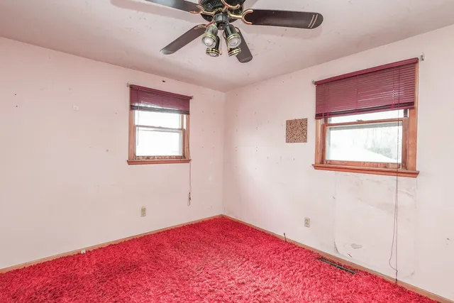 a bathroom with a toilet a sink and tub
