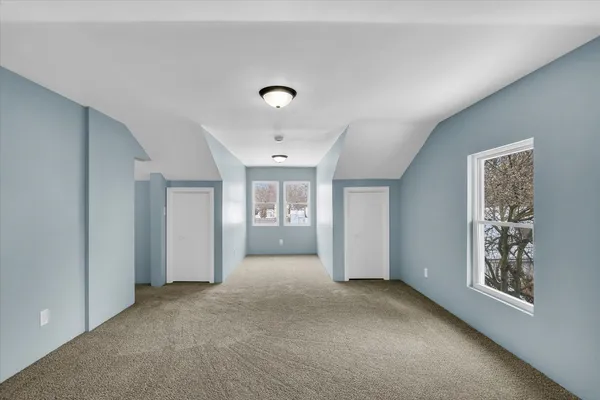 a view of empty room with wooden walls