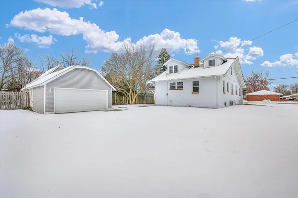 a view of a house with a snow in front of it