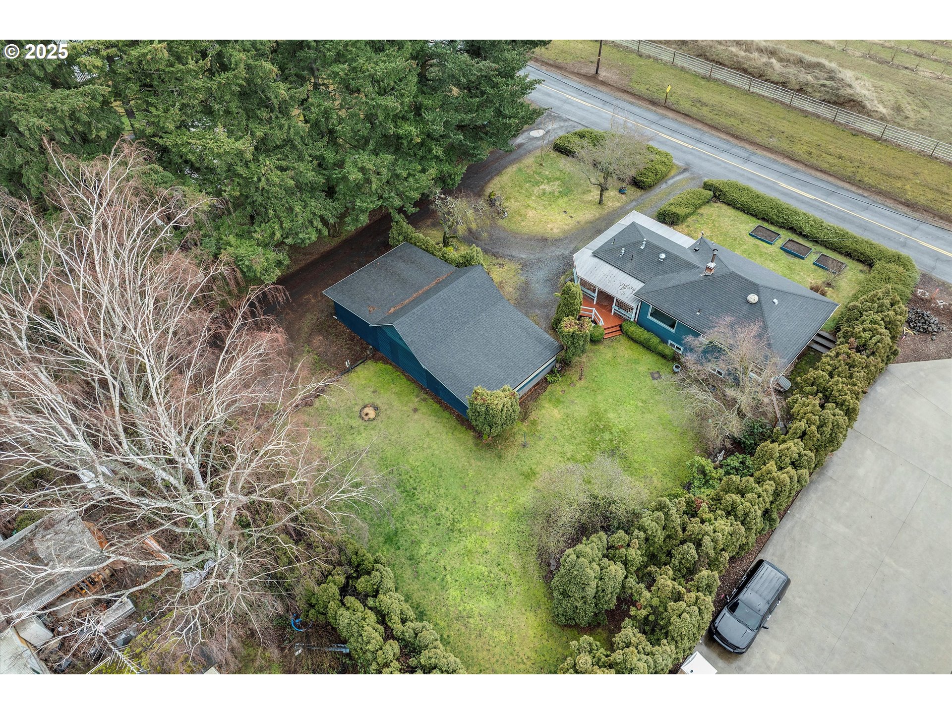 1684 Orchard Road Hood River, OR 97031 - Photo 34 of 47 a view of a house with a yard and a large tree