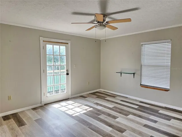 a view of an empty room with a window
