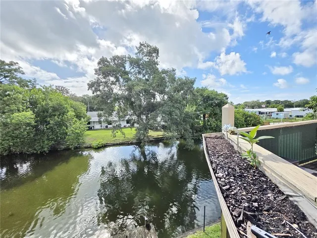 a view of a lake with a yard