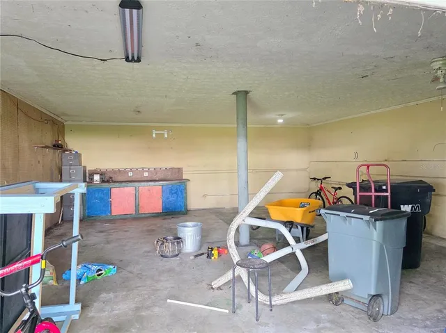 a utility room with dryer and bicycles