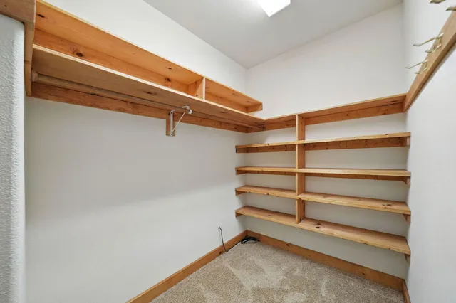 a view of room with racks on the wall