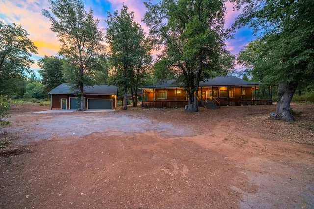 a house view with a backyard space