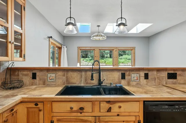 a kitchen with a sink and a window