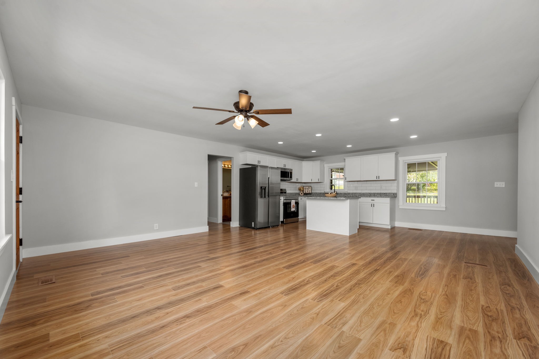 210 Rigney Drive Manchester, TN 37355 - Photo 12 of 39 a view of a kitchen with wooden floor and a sink